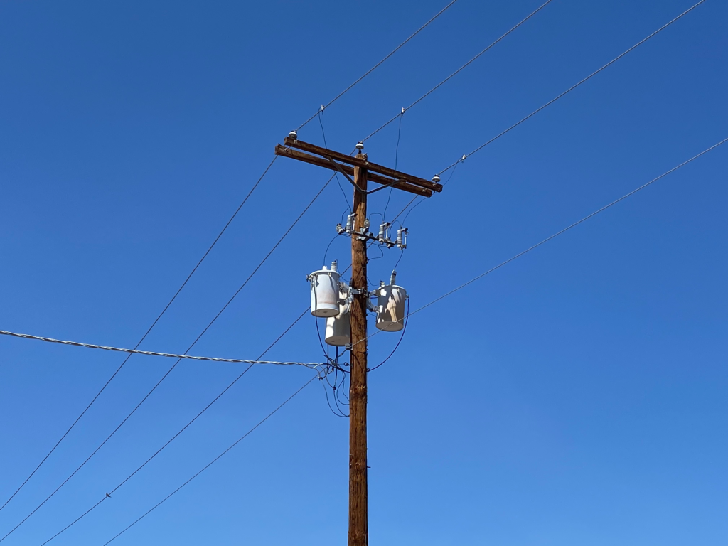 Distribution transformer on power line pole